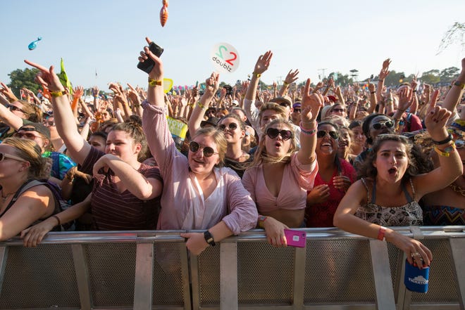 A heavy crowd waves their arms at Austin City Limits Music Festival in 2015. Along with sunscreen, bugspray, comfortable shoes and sunglasses, bring ear protection to the fest, too. [Suzanne Cordeiro for AMERICAN-STATESMAN 2015]
