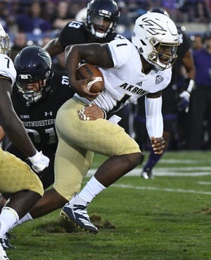 Akron quarterback Kato Nelson has rushed for 135 yards and passed for 662 in three games this season. [Matt Marton/The Associated Press]