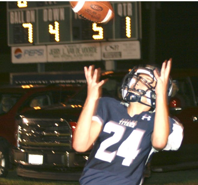 Annawan/Wethersfield's Kale Nelson hauls in a pass during the Titans' win over Mid-County Friday.
