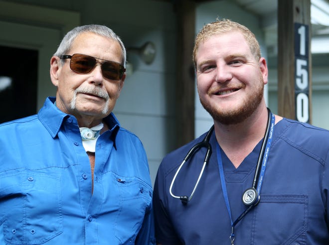 Steve Jenkins stands for a photo with RN Dustin Womble on Wednesday in Panama City. The two are planning a trip to the Georgia Aquarium through the Dream Foundation. [PATTI BLAKE/THE NEWS HERALD]