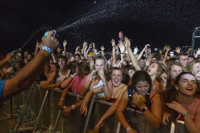 Security guards spray water on the crowd as they watch ODESZA during weekend one of Austin City Limits Music Festival at Zilker Park, Friday, Oct. 5, 2018. [Stephen Spillman / for American-Statesman]