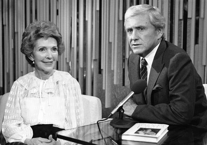 First lady Nancy Reagan meets with talk show host Merv Griffin in Los Angeles on Oct. 6, 1982, when she appeared for a taping of Griffin's show to promote her new book on foster grandparents, "To Love A Child." [Craig Molenhouse/The Associated Press]