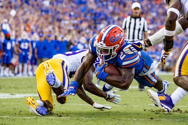 Florida running back Lamical Perine scores a touchdown during the fourth quarter Saturday against LSU at Ben Hill Griffin Stadium. [Lauren Bacho/Staff photographer]