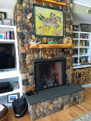 This stone fireplace doesn't smoke because it matches the necessary dimensions. [Tribune Content Agency]