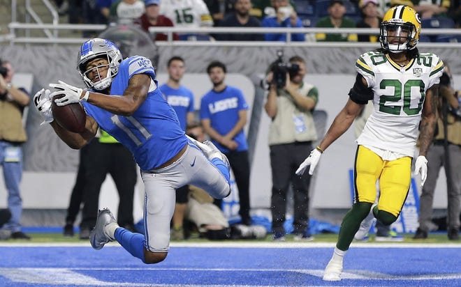 Detroit Lions wide receiver Marvin Jones (11), defended by Green Bay Packers cornerback Kevin King (20), catches an 8-yard pass for a touchdown during the first half of an NFL football game, Sunday, Oct. 7, 2018, in Detroit. (AP Photo/Rey Del Rio)