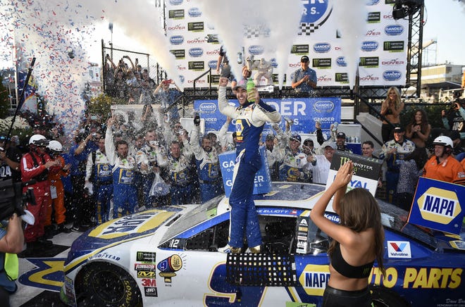 Chase Elliott, center, celebrates in Victory Lane after he won a NASCAR Cup Series auto race on Sunday at Dover International Speedway in Dover, Del. [AP PHOTO/NICK WASS]