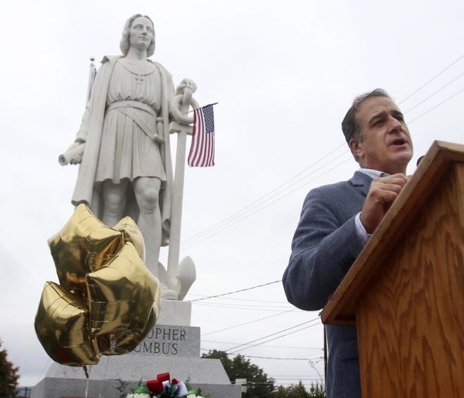 Pittston, Pa., Mayor Michael Lombardo addresses a gathering in front of the town's Christopher Columbus statue on Sunday, in Pittston. Critical study of historical figures like Columbus yields a deeper understanding, writes Renee Blackmon. [DAVE SCHERBENCO/THE CITIZEN'S VOICE VIA AP)