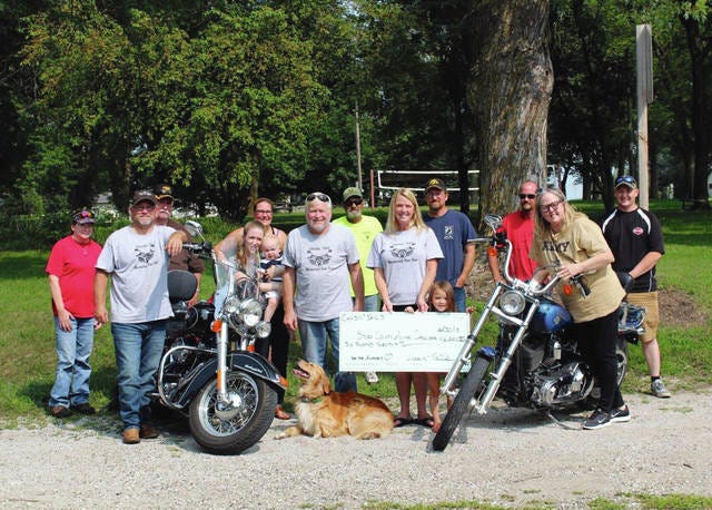 Members of the Chasin’ Tails event committee gathered for a check presentation for the Story County Animal Shelter after this year’s motorcycle ride. Pictured, from left, are Sheryl Buck, Mike Wearmouth, Bob Buck, Whitney Jermier, Mick Jermier, Tina Oberhokamp, Bob Ihle, Randy Oberhokamp, Amy Wearmouth, Nora Lu, Matt Mcbeth, Kalon Oberhokamp, Sue McCaskey (with the shelter) and Mike Jermier. contributed photo
