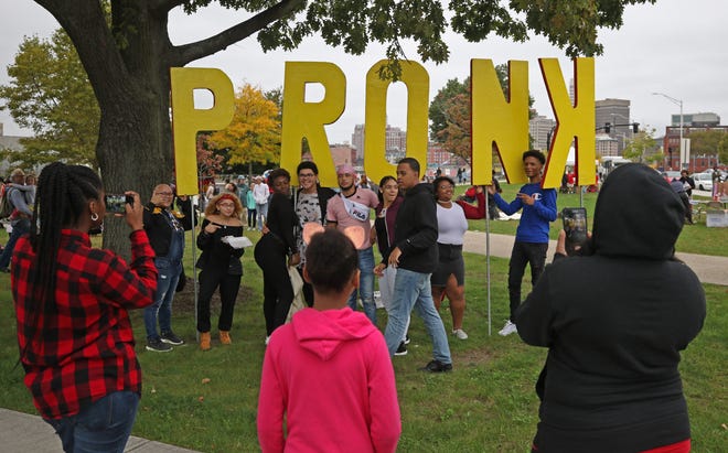 Students from the Trinity Academy for the Performing Arts in Providence photograph each other by the large letters spelling out "PRONK." [The Providence Journal / Steve Szydlowski]