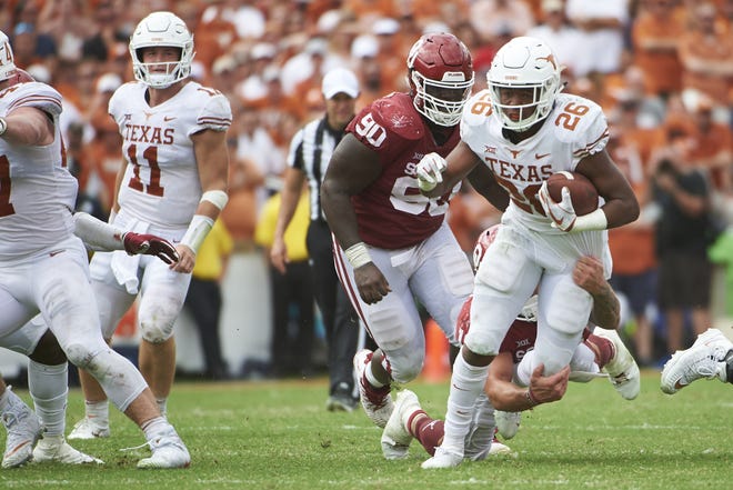 Texas running back Keaontay Ingram breaks free against Oklahoma during the second half at the Cotton Bowl on Saturday in Dallas. [AP Photo/Cooper Neill]