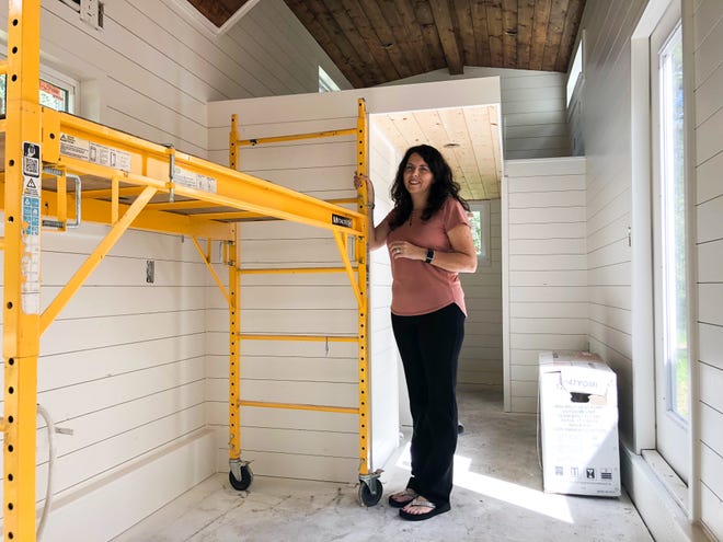 Tommie Arnold, founder of Arnold Custom Builders in Bastrop County, stands in a tiny home she is building for a customer. [Brandon Mulder, Bastrop Advertiser]