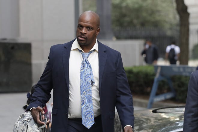 Brian Bowen Sr. arrives at federal court in New York on Oct. 4. Bowen, the father of blue-chip college basketball recruit Brian Bowen Jr., changed his testimony Tuesday and couldn’t recall whether Texas may have offered improper benefits to recruit his son. [AP Photo/Mark Lennihan]