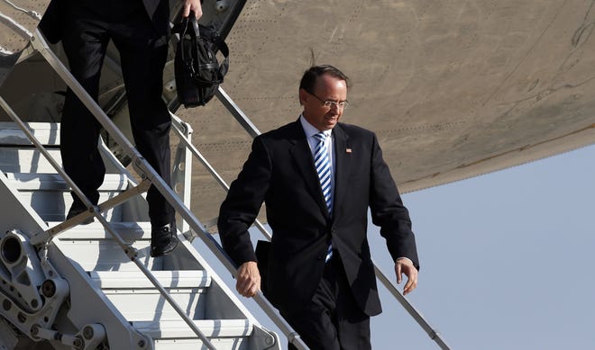 Deputy Attorney General Rod Rosenstein steps off Air Force One upon its return Monday to Andrews Air Force Base in Maryland. [Alex Brandon/The Associated Press]