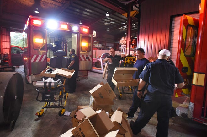 Teams from Jacksonville Fire and Rescue were busy stocking ambulances at the Tactical Support facility on Ellis Road Tuesday morning. [Bob Self/Florida Times-Union]
