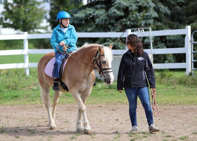Renate Schwope rides laps around a pasture at Heritage Christian Stables in Webster. [PHOTO PROVIDED/BOB WARD]