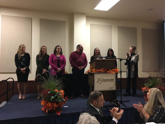 Carolyn Witherspoon, chair of the Panhandle Great 25 Nurses scholarship committee, recognizes the six nursing students who received scholarships Tuesday night. {Tim Howsare/For the Amarillo Globe-News]