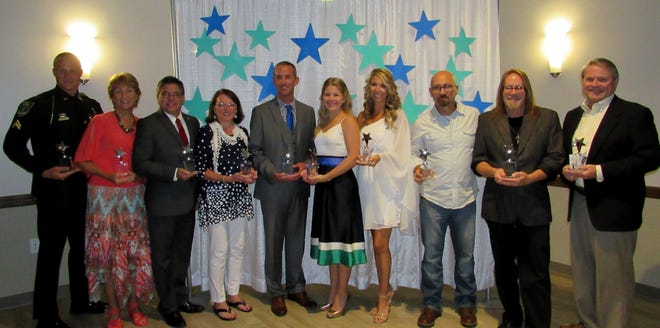The Celebrating Our Community Stars awards ceremony on Saturday, hosted by the Rotary Club of Palm Coast, recognizes those who are making a difference in the community including, from left, Robert Tarczewski, Bebe Kelly, Nate McLaughlin, Mary Louk, Austin Yelvington, Maureen Walsh, Brandi Fowler, Trent Schake, Anthony Wild, Tom Grimes. [Photos provided]