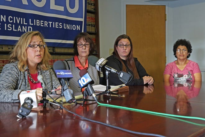 The ACLU of Rhode Island announces a series of legal actions being taken on behalf of students with disabilities who are caught up in the Providence school bus strike. From left, ACLU volunteeer lawyer Christine Marinello, Anne Mulready of the R.I. Disability Law Center, and parents C.T. Young and Gloria Santos. [The Providence Journal / Steve Szydlowski]