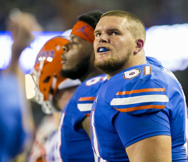 Florida offensive linemen Brett Heggie (61) and Jawaan Taylor are making progress in forming a strong unit. [Cyndi Chambers/Correspondent]