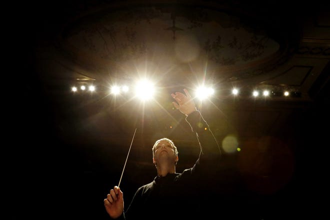 New Bedford Symphony Orchestra conductor Yaniv Dinur conducts the orchestra at the Zeiterion Performing Arts center in New Bedford. [PETER PEREIRA/THE STANDARD-TIMES/SCMG]