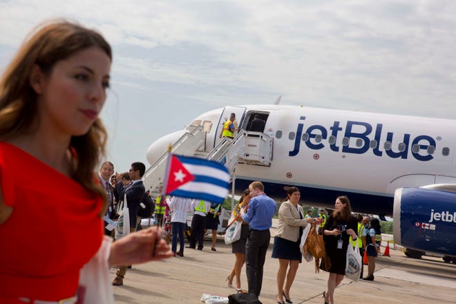 Passengers of JetBlue flight 387 arrive at the airport in Santa Clara, Cuba, Wednesday, Aug. 31, 2016.