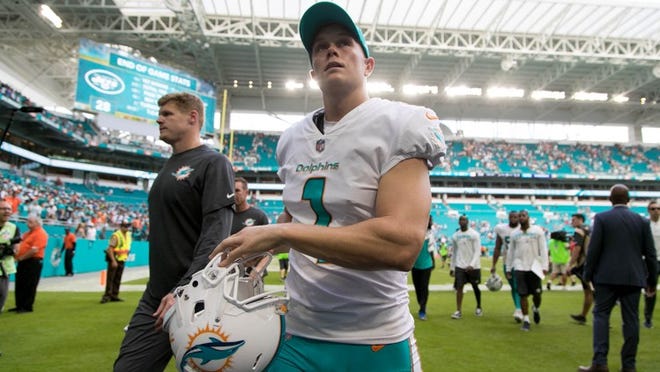 Miami Dolphins kicker Cody Parkey (1) leaves the field after kicking game winning field goal against the Jets at Hard Rock Stadium in Miami Gardens on October 22, 2017. (Allen Eyestone / The Palm Beach Post)