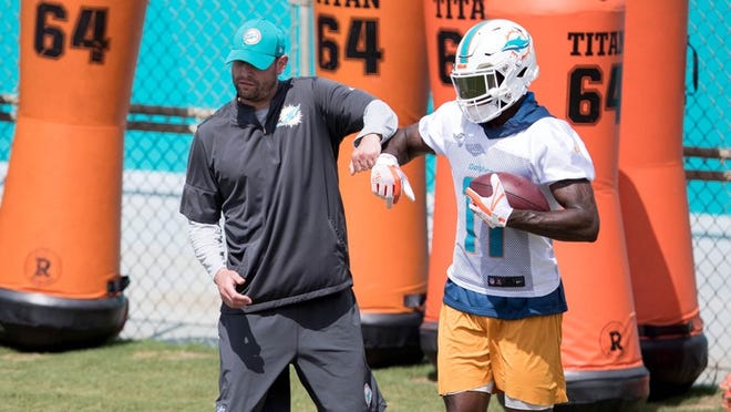 Miami Dolphins head coach Adam Gase with Miami Dolphins wide receiver DeVante Parker (11) during organized team activities The Baptist Health Training Facility at Nova Southeastern University in Davie, Florida on May 30, 2018. (Allen Eyestone / The Palm Beach Post)