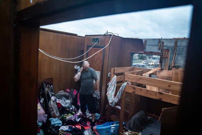 Jason Phipps looks through his families roofless apartment in Panama City, Fla., after Hurricane Michael made landfall along the Florida panhandle on Oct. 10, 2018. MUST CREDIT: Washington Post photo by Jabin Botsford.