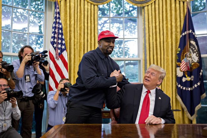 Rapper Kanye West shakes hands with President Donald Trump during a meeting in the Oval Office in the White House on Oct. 11, 2018. MUST CREDIT: Bloomberg photo by Andrew Harrer.