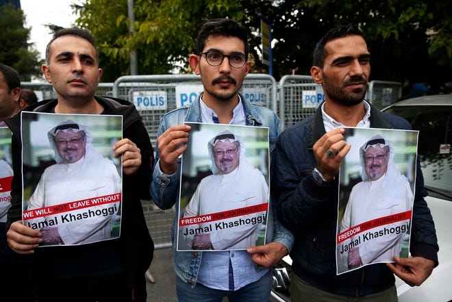Members of the Turkish-Arab journalist association hold posters with photos of missing Saudi writer Jamal Khashoggi, as they hold a protest near the Saudi Arabia consulate in Istanbul, Monday, Oct. 8, 2018. Khashoggi, 59, went missing on Oct 2 while on a visit to the consulate in Istanbul for paperwork to marry his Turkish fiancée. The consulate insists the writer left its premises, contradicting Turkish officials. He had been living since last year in the U.S. in a self-imposed exile, in part due to the rise of Prince Mohammed, the son of King Salman. (AP Photo/Lefteris Pitarakis)