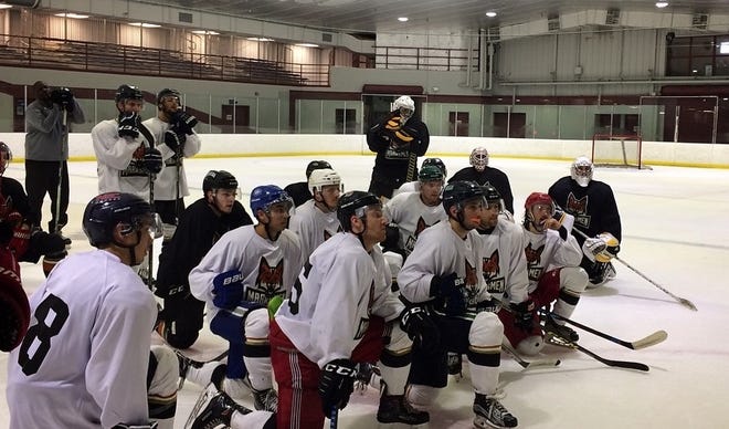 Fayetteville Marksmen players listen in as coach Jesse Kallechy lays out what he wants from practice Thursday at Cleland Ice Rink on Fort Bragg. [Shawn Bednard/Fayetteville Marksmen]