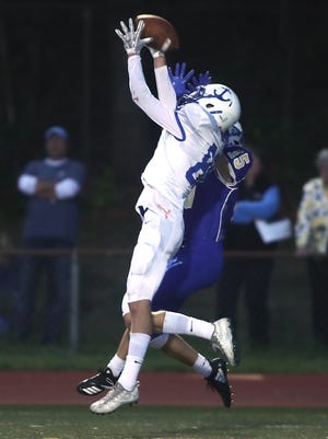 Scituate's Garrett McKinnon breaks up the pass intended for Norwell's Garrett McGlinchey during first-quarter action of their game at Scituate High on Friday, Sept. 7, 2018. [Wicked Local Staff Photo/ Robin Chan]