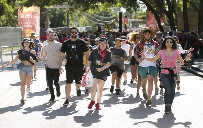 Fans race through the gates during weekend one of the Austin City Limits Music Festival in Zilker Park on Friday October 5, 2018. The gates opened right on time at 11 a.m. for weekend two on Friday, October 12. [JAY JANNER/AMERICAN-STATESMAN]