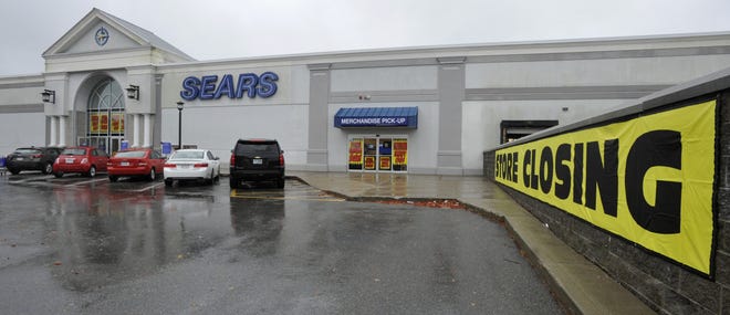 Signs alert shoppers outside the Sears at the Cape Cod Mall that the store is closing. [Steve Heaslip/Cape Cod Times]