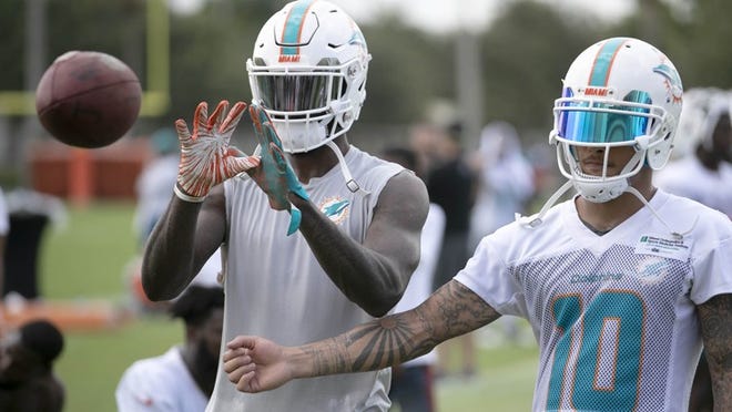 Miami Dolphins wide receiver DeVante Parker (11) and Miami Dolphins wide receiver Kenny Stills (10) at training camp in Davie, Florida on July 27, 2018. (Allen Eyestone / The Palm Beach Post)