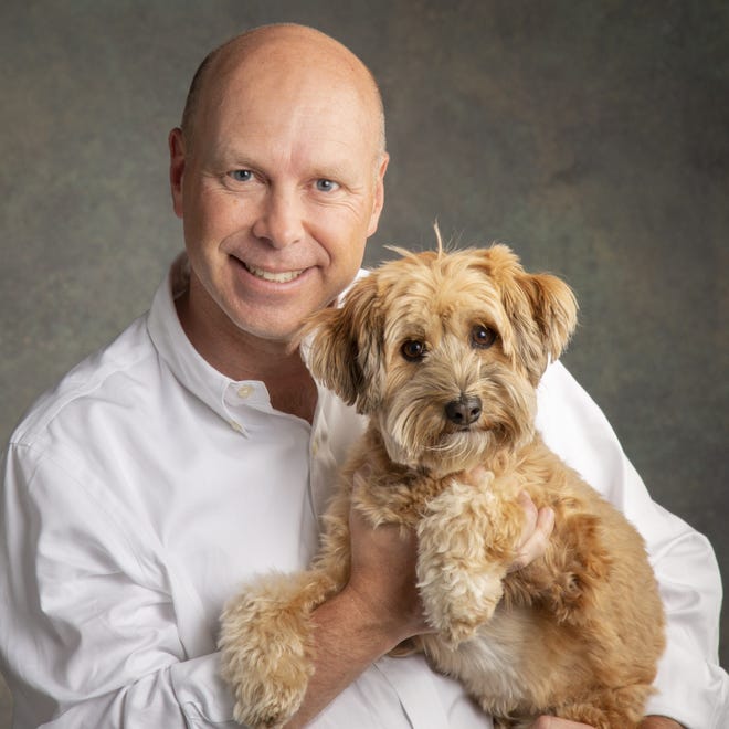 Timothy W. Simonds, new CEO of Merrick Pet Care Inc., with his dog, Poppy