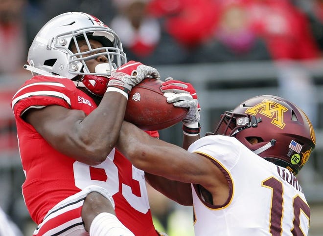 Ohio State Buckeyes wide receiver Terry McLaurin (83) makes a touchdown catch against Minnesota Golden Gophers defensive back Coney Durr (16) in the 1st quarter of their game at Ohio Stadium in Columbus on Saturday. [Photo by Kyle Robertson]
