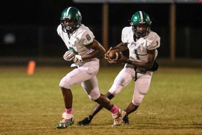 Father Lopez quarterback T.J. Lockley accounted for three touchdowns in a win over Taylor on Friday, all but assuring the Green Wave's first playoff berth since 2013. [News-Journal/Lola Gomez]