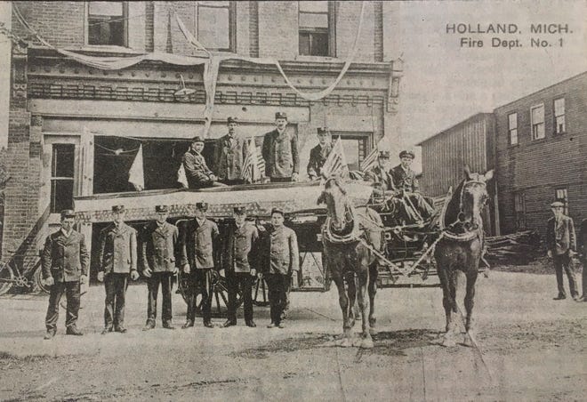 Holland firefighters stand outside their West Eighth Street fire station in the late 1800s with buckets and horses. These firefighters were part of the Eagle Hose Company and the Star Hook and Ladder company. [Courtesy/Holland Historical Trust Collection]