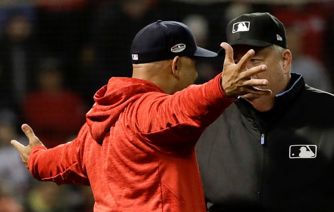 Red Sox manager Alex Cora argues a strike-three call with umpire Joe West during the fifth inning of Game 1 of the ALCS. He was ejected from the game.