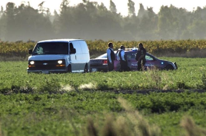 A coroner's van arrives to transport the body of a skydiver who fell to her death in a field west of the Lodi Parachute Center in Acampo, Calif., on Sunday. At least 15 skydivers using the facility to make jumps were killed between 1999 and 2017. [Clifford Oto/The Stockton (Calif.) Record]