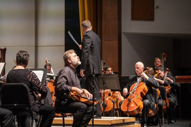 Special guest artist Stephen Seifert performs with a mountain dulcimer and a Tennessee music box Sunday as the Adrian Symphony Orchestra opened its 2018-19 season.