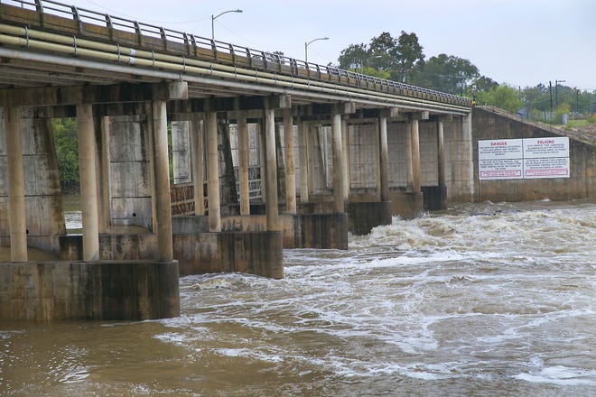 The gates at Longhorn Dam have been opened to ease the overflow of floodwaters from Lady Bird Lake downstream to the Colorado River. [FILE PHOTO]