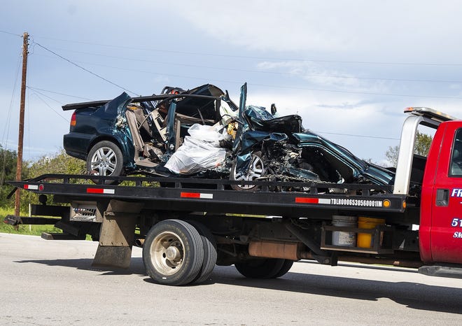 A vehicle is moved from the scene of an accident on Texas 95 in Bastrop on Oct. 7, 2018. Texas DPS reported four fatalities as a result of the two-vehicle accident, and one child was air lifted to Dell Children's Hospital in Austin where they are in critical condition. [NICK WAGNER/BASTROP ADVERTISER]