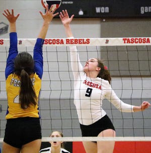 Tascosa' s Harper Steph (9) tips the ball over a net and past a Frenship defender for a point durin the Lady Rebels District 2-6A matchup on Tuesday night at the THS Activity Center. [Tyler Anderson/ Amarillo Globe-News]