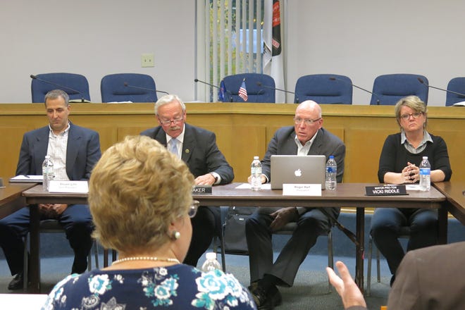 From left, Tecumseh Public Schools Treasurer Steven Linn, Mayor Jack Baker, TPS board president Roger Hart and council member Vickie Riddle listen to a presentation of a draft agreement by city manager Dan Swallow during a joint study session Monday between the Tecumseh City Council and TPS board to discuss a new School Resource Officer collaboration.