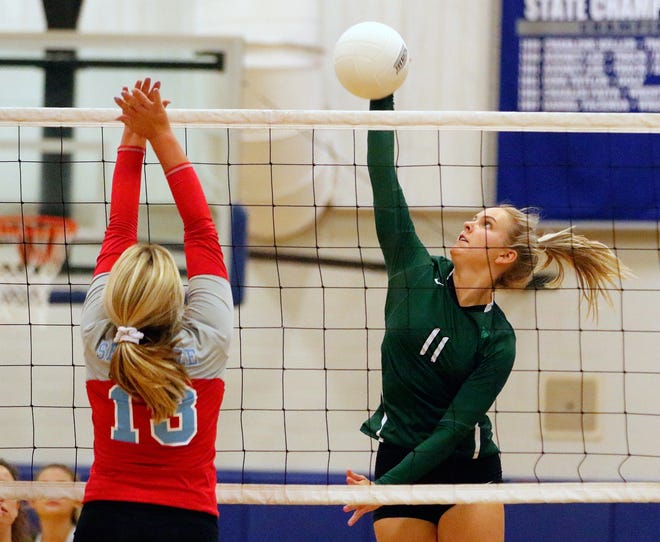 Father Lopez and Kyndal Linge (11) eliminated Seabreeze and Haley Nirchl (13) in the District volleyball tournament in Deltona High School Monday. [News-Journal/Nigel Cook]
