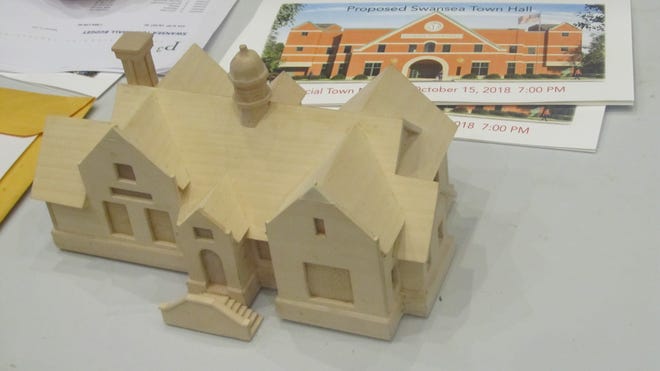 Architect's wooden model of proposed two-story, 18,597 square-foot Town Hall on table at Monday night's special Town Meeting.

[Herald News Photo | Michael Holtzman]