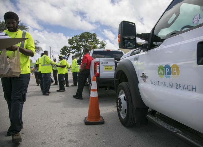 City of West Palm Beach utility trucks and 24 employees ready to head to the Panhandle to assist in the recovery of hurricane Michael Monday Oct. 15, 2018, in West Palm Beach. [BILL INGRAM/pbpost.com]