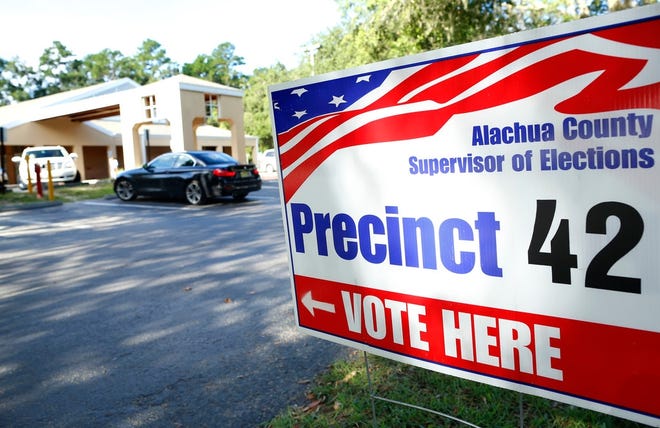 A voting sign outside the Tower Road Branch of the Alachua County Library on SW 75th Street in Gainesville. [Brad McClenny/The Gainesville Sun]